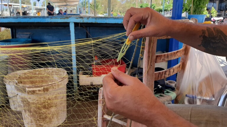 repairing fishing fear port nea kios argolis greece